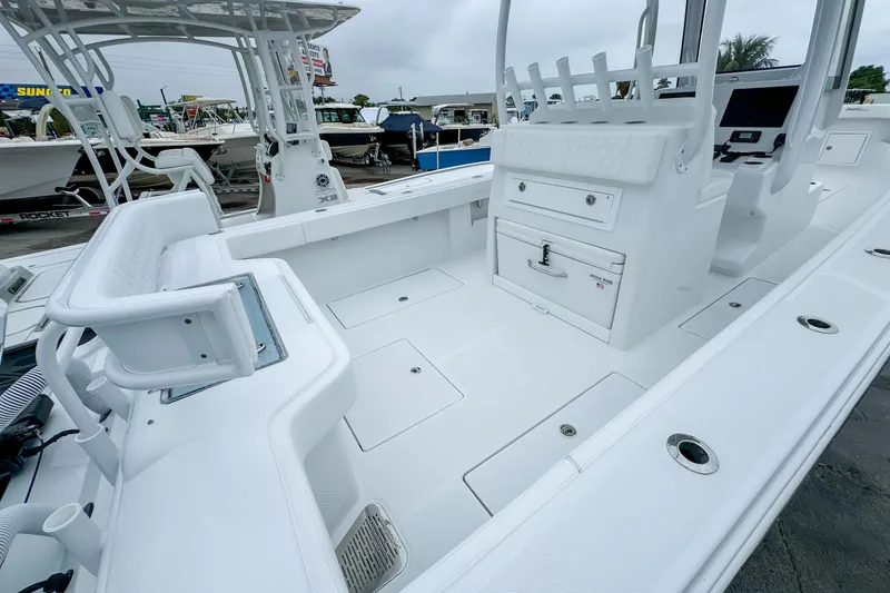 Slide: The Image of 2026 Front Runner 33 Center Console boat's electrical system and storage compartment. - 20