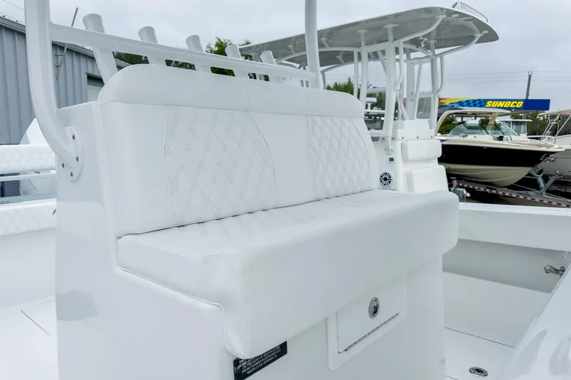 Slide: The Image of 2026 Front Runner 33 Center Console boat interior with electrical systems and marine toilet. - 25