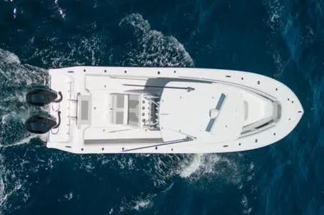 Slide: The Image of 2026 Front Runner 33 Center Console boat with wet deck detail. - 6