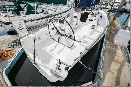 The Image of 2013 J Boats J/111 sailboat docked, featuring a spacious cockpit and sleek design. - 0