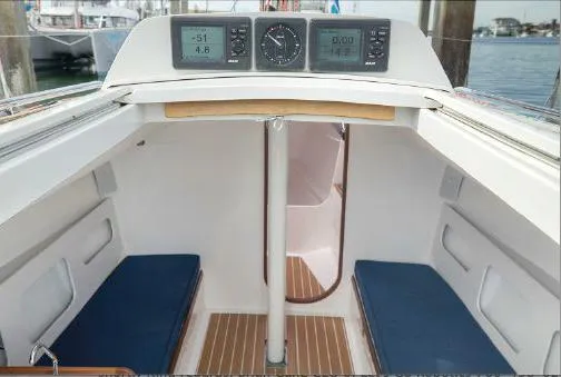 Slide: The Image of 2013 J Boats J/111 interior with blue cushions and navigation instruments. - 10