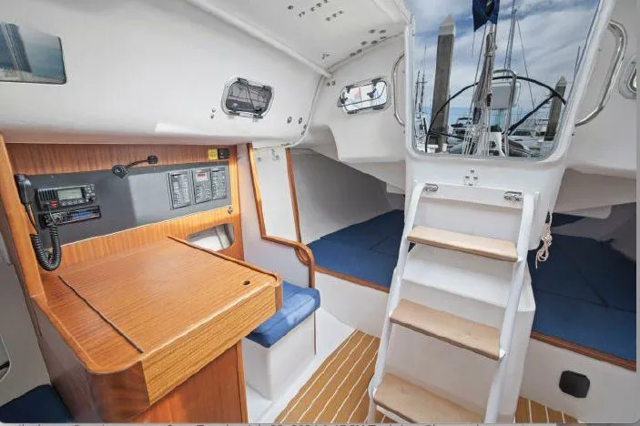 Slide: The Image of Interior of 2013 J Boats J/111 sailboat with navigation station and cabin view. - 13