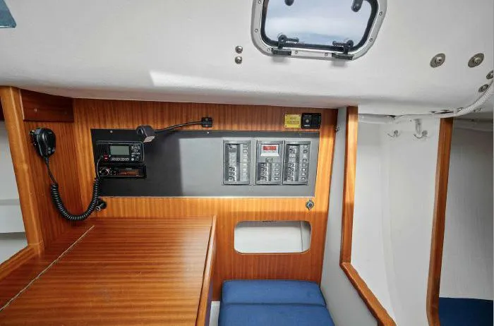 Slide: The Image of 2013 J Boats J/111 interior with control panel and wooden finish. - 14