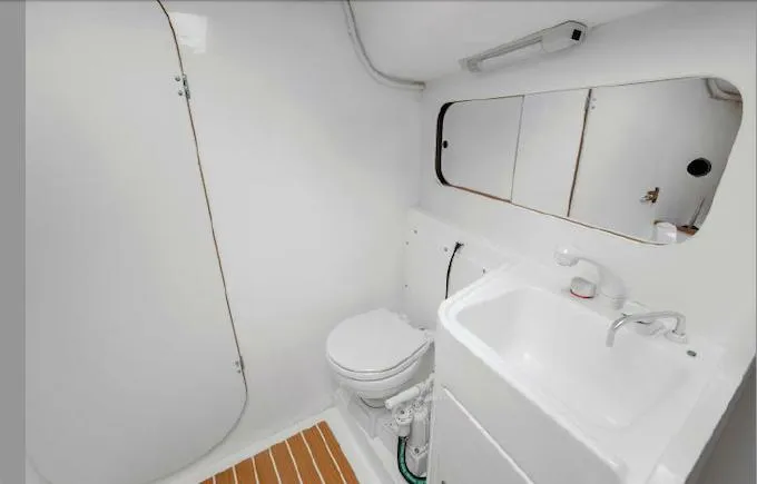 Slide: The Image of 2013 J Boats J/111 yacht bathroom with sink, toilet, and mirror. - 16