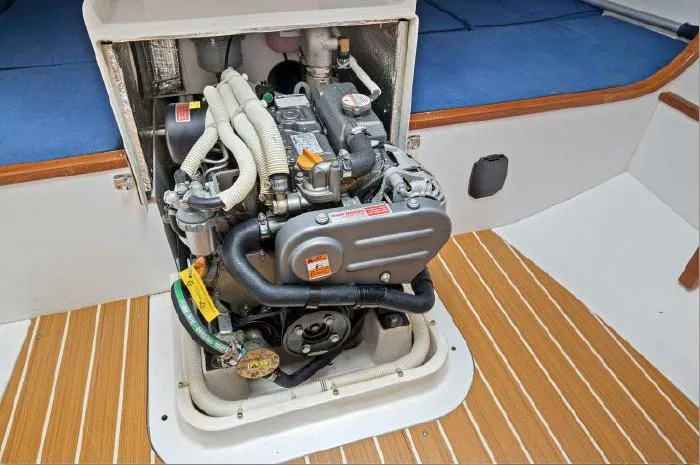 Slide: The Image of Engine compartment of a 2013 J Boats J/111 sailboat, showcasing the engine and interior details. - 19