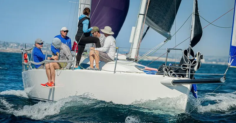 Slide: The Image of Sailing crew on a 2013 J Boats J/111 yacht navigating ocean waves. - 3