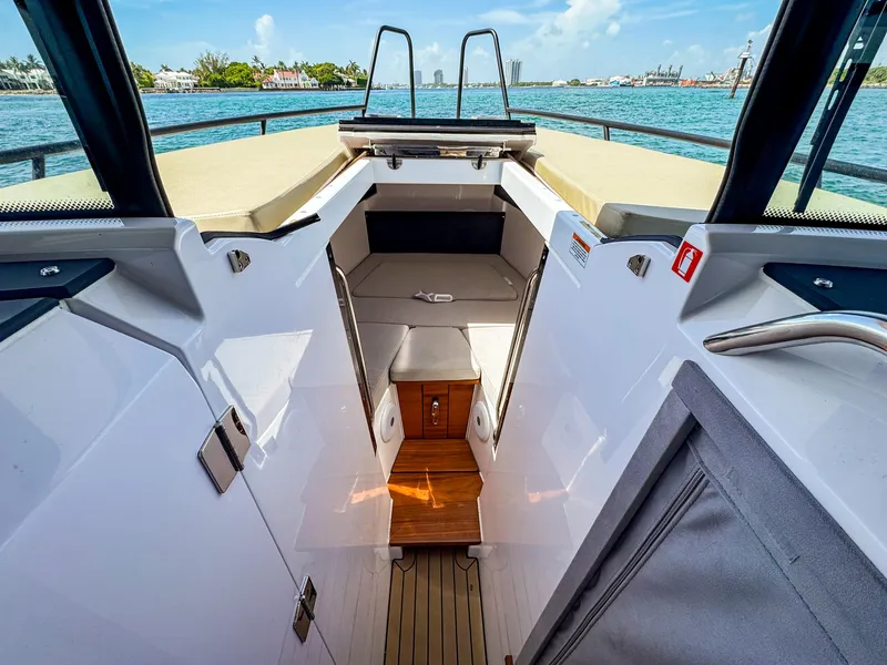 Slide: The Image of 2024 XO Boats EXPLR 10S Plus interior with seating and water view. - 15