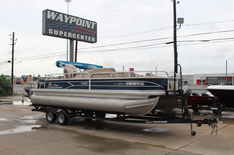The Image of 2019 Sun Tracker Fishin' Barge 22 DLX pontoon boat at Waypoint Marine Supercenter. - 1