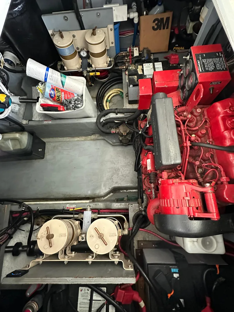 Slide: The Image of Engine room of a 1999 Sea Ray 400 Sedanbridge with visible components and equipment. - 33