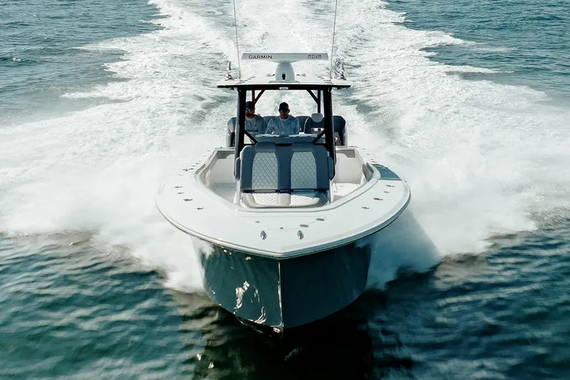 Slide: The Image of 2026 Front Runner 39 Center Console boat on trailer under blue sky. - 1