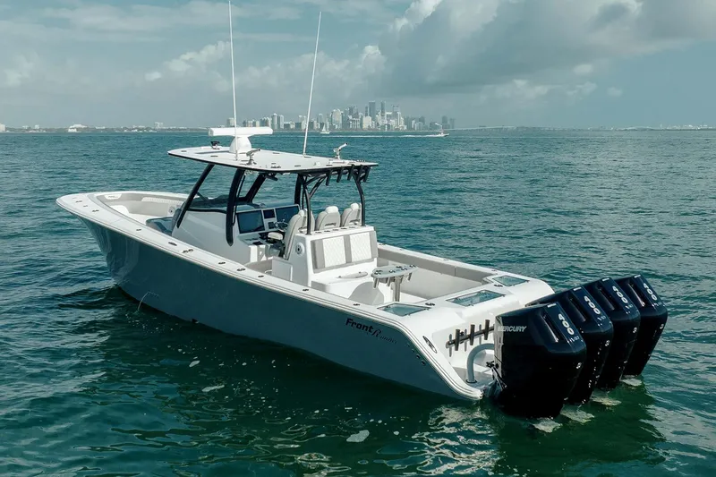 Slide: The Image of 2026 Front Runner 39 Center Console boat interior with white seating and speakers. - 10