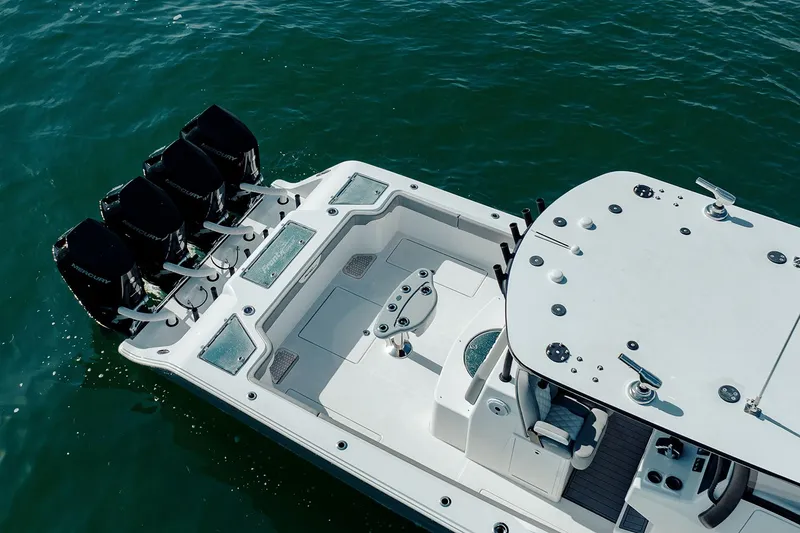 Slide: The Image of 2026 Front Runner 39 Center Console boat storage compartments under clear blue sky. - 15