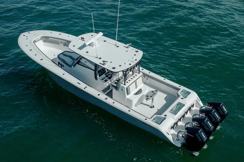 Slide: The Image of 2026 Front Runner 39 Center Console boat interior with storage compartments and seating. - 16