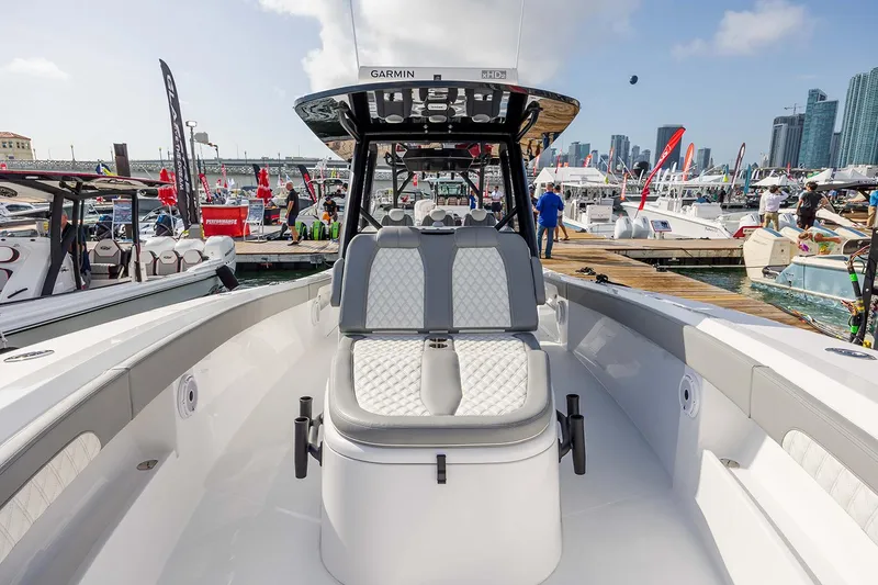 Slide: The Image of Luxurious seating on 2026 Front Runner 39 Center Console boat under blue sky. - 19