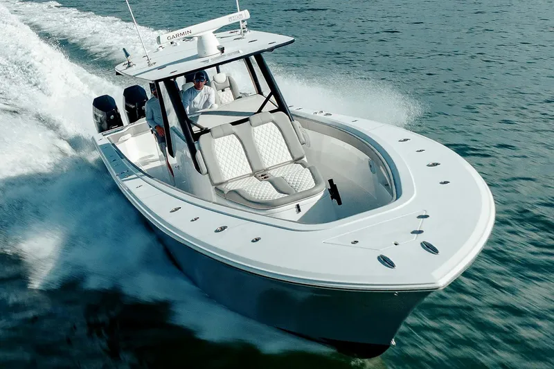 Slide: The Image of 2026 Front Runner 39 Center Console boat on trailer, under a cloudy sky. - 2