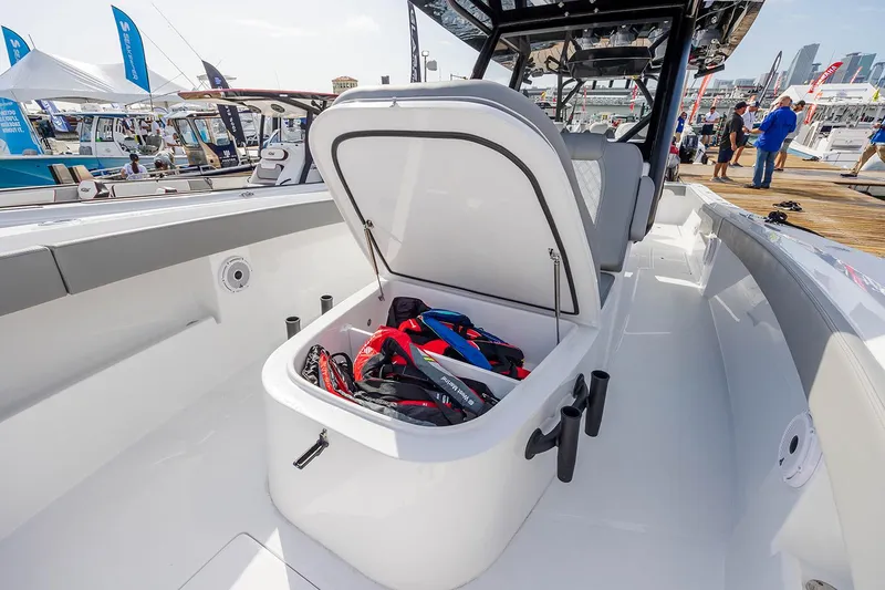 Slide: The Image of 2026 Front Runner 39 Center Console boat speakers and storage compartment detail. - 21