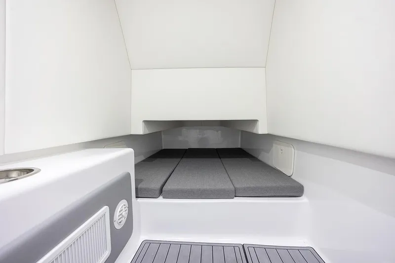 Slide: The Image of Interior view of 2026 Front Runner 39 Center Console boat with blue ceiling and navigation equipment. - 28