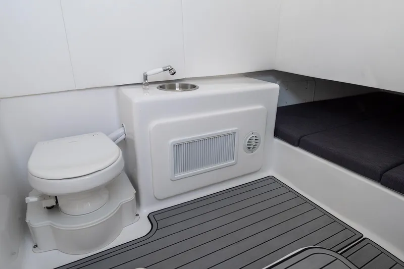 Slide: The Image of 2026 Front Runner 39 Center Console interior with toilet, sink, and seating area. - 31