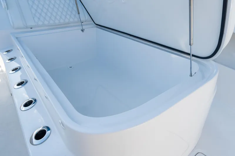 Slide: The Image of Open storage compartment on 2026 Front Runner 39 Center Console boat. - 39