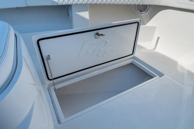 Slide: The Image of Open storage compartment on 2026 Front Runner 39 Center Console boat. - 40