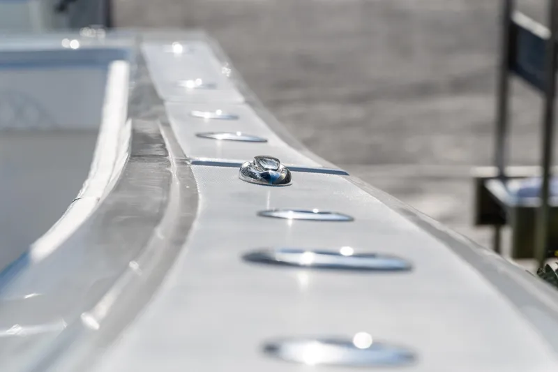 Slide: The Image of Close-up of 2026 Front Runner 39 Center Console boat's sleek metallic details. - 45