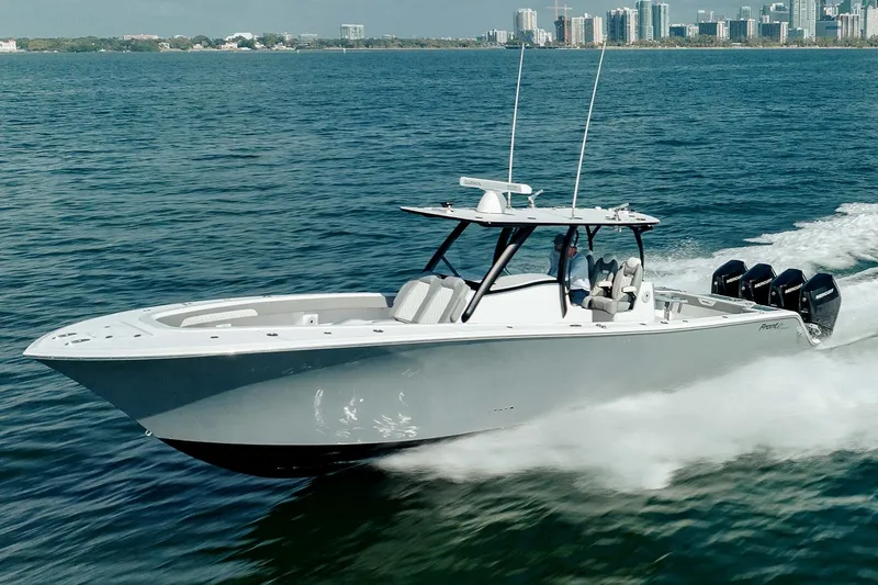 Slide: The Image of 2026 Front Runner 39 Center Console boat with multiple outboard engines, parked outdoors. - 5