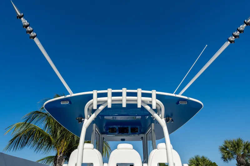 Slide: The Image of 2026 Front Runner 39 Center Console boat with blue sky and palm trees. - 52