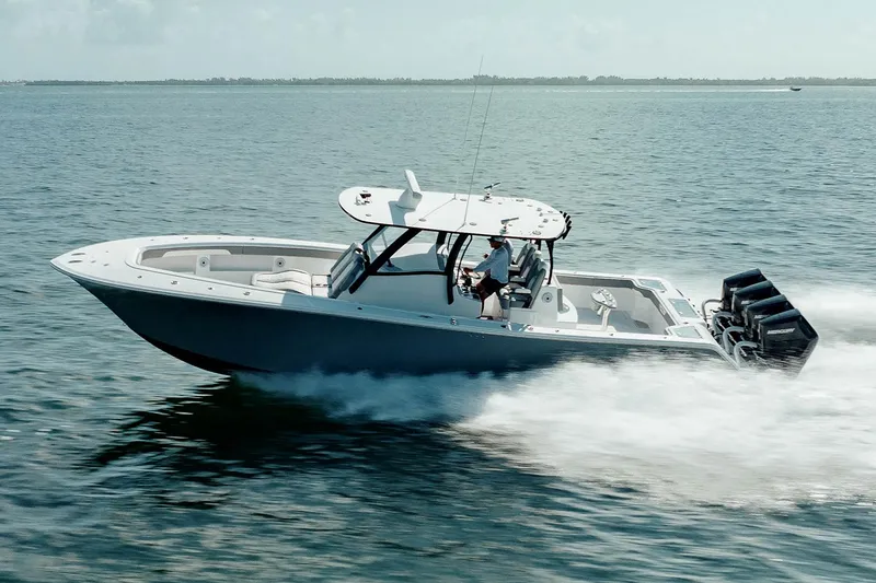 Slide: The Image of 2026 Front Runner 39 Center Console boat with quad outboard engines, spacious deck, and seating. - 7