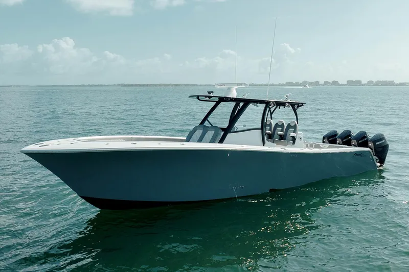 Slide: The Image of 2026 Front Runner 39 Center Console boat with four powerful engines and fishing rod holders. - 8