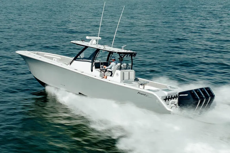 Slide: The Image of 2026 Front Runner 39 Center Console with powerful outboard engines and sleek design. - 9