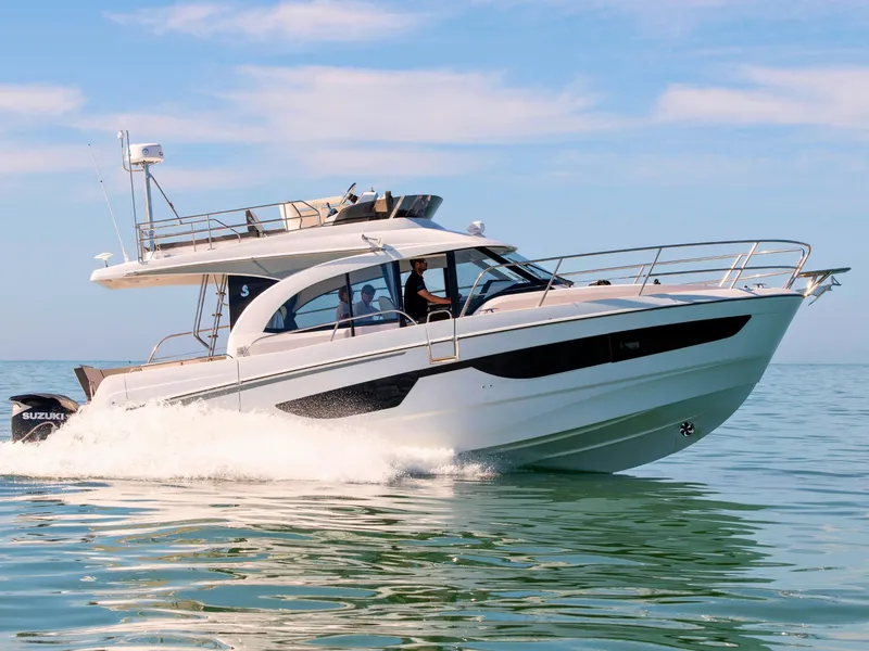 The Image of 2026 Beneteau Antares 11 Fly cruising on calm waters under a clear blue sky. - 0
