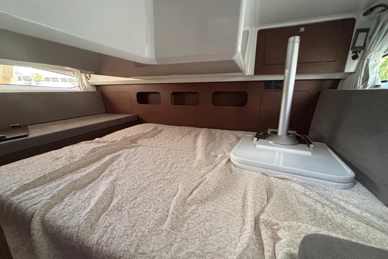 Slide: The Image of Interior cabin of 2026 Beneteau Antares 11 Fly, featuring a cozy bed and modern design. - 22