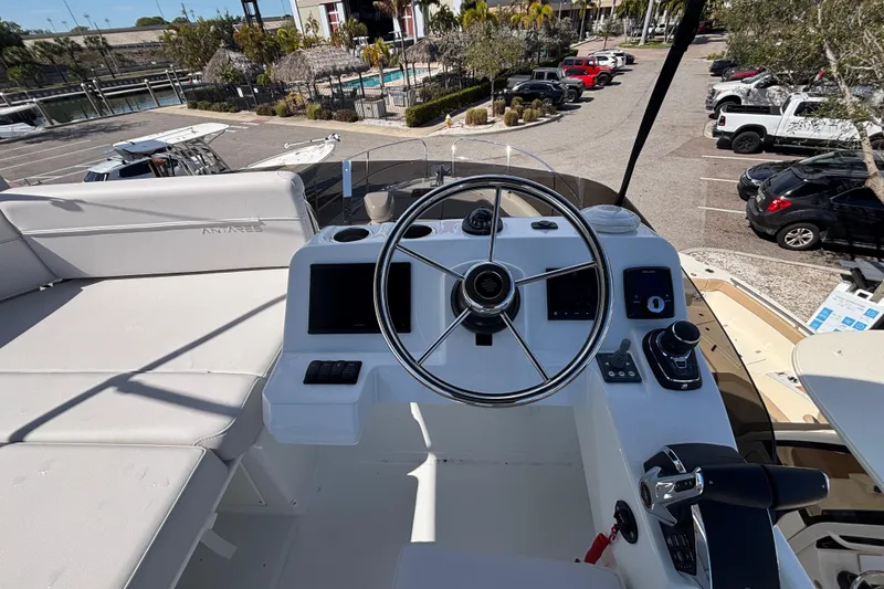 Slide: The Image of Flybridge helm of 2026 Beneteau Antares 11 Fly, featuring modern controls and steering wheel. - 26