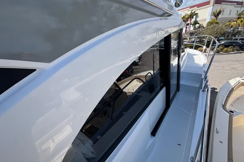 Slide: The Image of 2026 Beneteau Antares 11 Fly yacht, sleek design with modern windows and railing. - 29