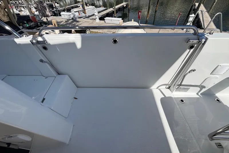 Slide: The Image of 2026 Beneteau Antares 11 Fly deck area with railing and dock view. - 34