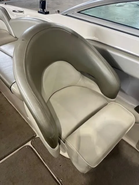Slide: The Image of 2006 Sea Ray Sundeck 240 boat seat with beige upholstery and sleek design. - 14