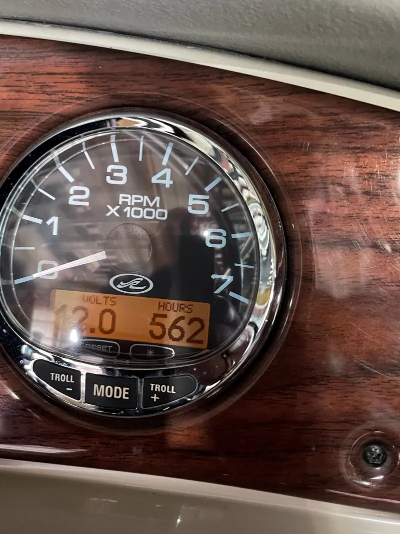 Slide: The Image of Tachometer of 2006 Sea Ray Sundeck 240 showing RPM, volts, and hours. - 18