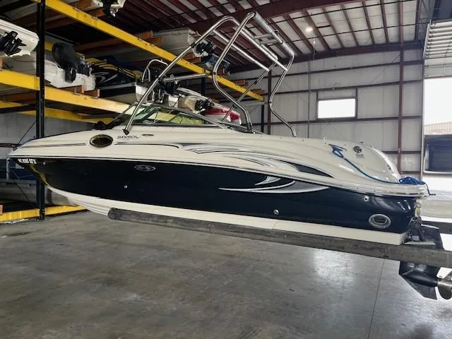 Slide: The Image of 2006 Sea Ray Sundeck 240 boat in indoor storage facility. - 2