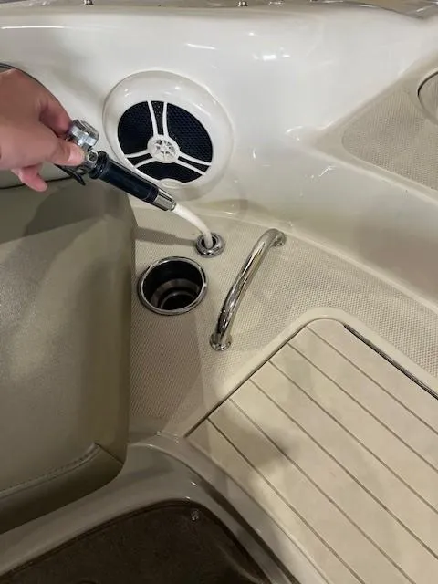 Slide: The Image of 2006 Sea Ray Sundeck 240 boat interior with speaker and hand shower. - 23