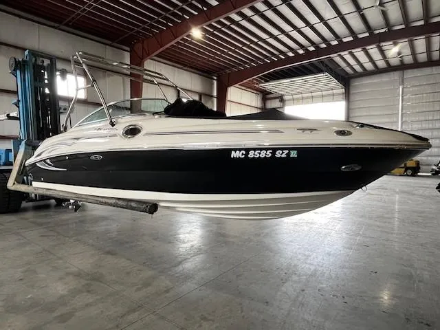 Slide: The Image of 2006 Sea Ray Sundeck 240 boat in warehouse, lifted by forklift. - 4