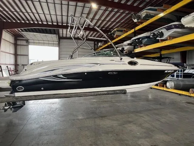 Slide: The Image of 2006 Sea Ray Sundeck 240 boat in storage facility, side view. - 5
