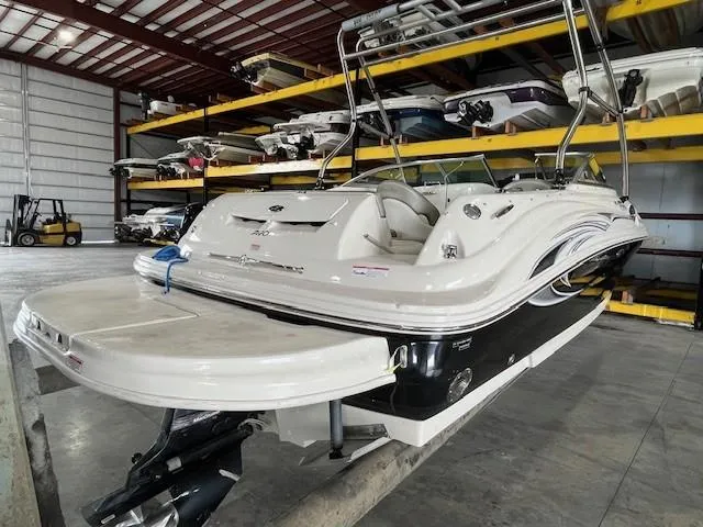 Slide: The Image of 2006 Sea Ray Sundeck 240 boat in indoor storage facility. - 6