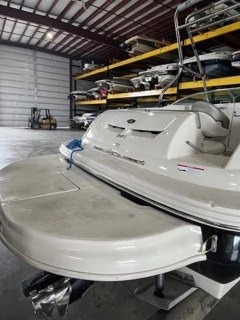 Slide: The Image of 2006 Sea Ray Sundeck 240 boat in storage facility with stacked boats. - 7