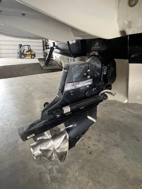 Slide: The Image of 2006 Sea Ray Sundeck 240 boat engine with MerCruiser outdrive in a garage setting. - 8