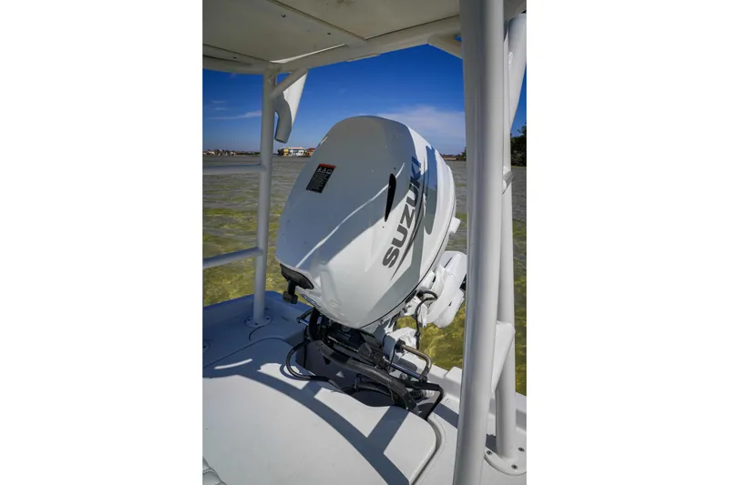 Slide: The Image of Custom XPC 16 boat with Suzuki outboard motor on calm water, 2025 model. - 15