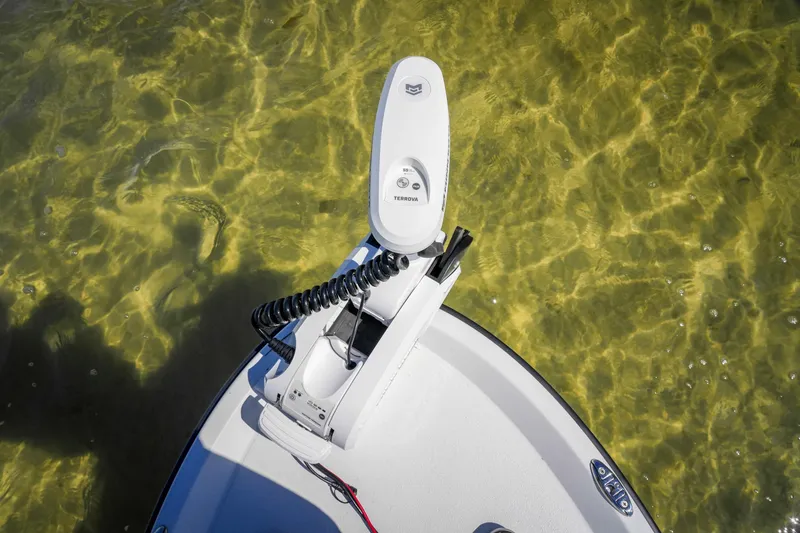 Slide: The Image of Custom XPC 16 boat with trolling motor in clear shallow water, 2025 model. - 16