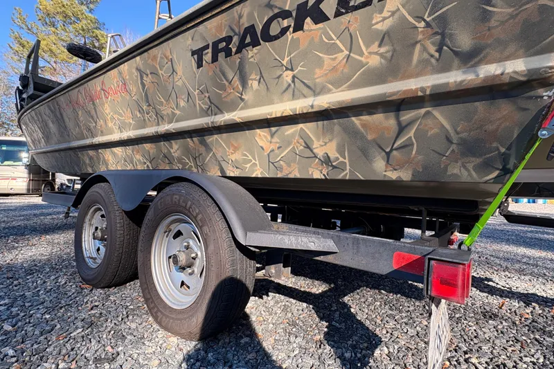 Slide: The Image of 2020 Tracker Grizzly 2072 boat with camouflage design on a trailer. - 15