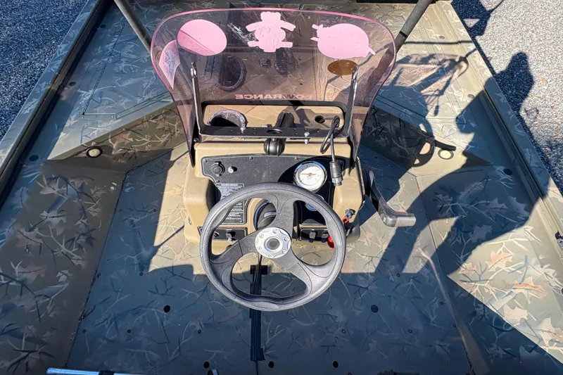 Slide: The Image of 2020 Tracker Grizzly 2072 boat interior with steering wheel and control panel. - 17