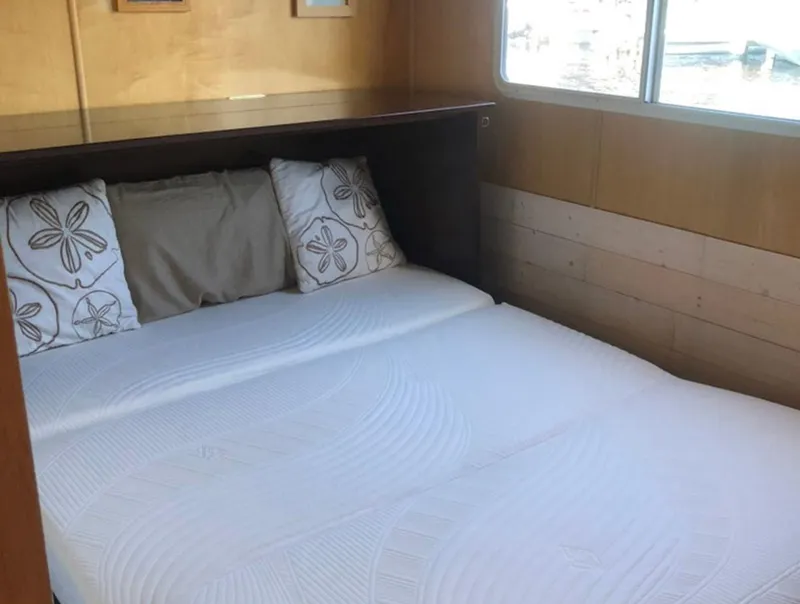 Slide: The Image of Cozy bedroom in 2000 Stardust Cruisers 6816 houseboat with window view. - 10