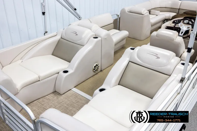 Slide: The Image of 2013 Bennington 2375 GCW pontoon boat interior with luxurious seating and steering console. - 12